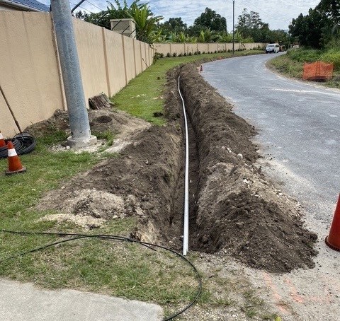 Roadside trench and conduit installation in Vanuatu